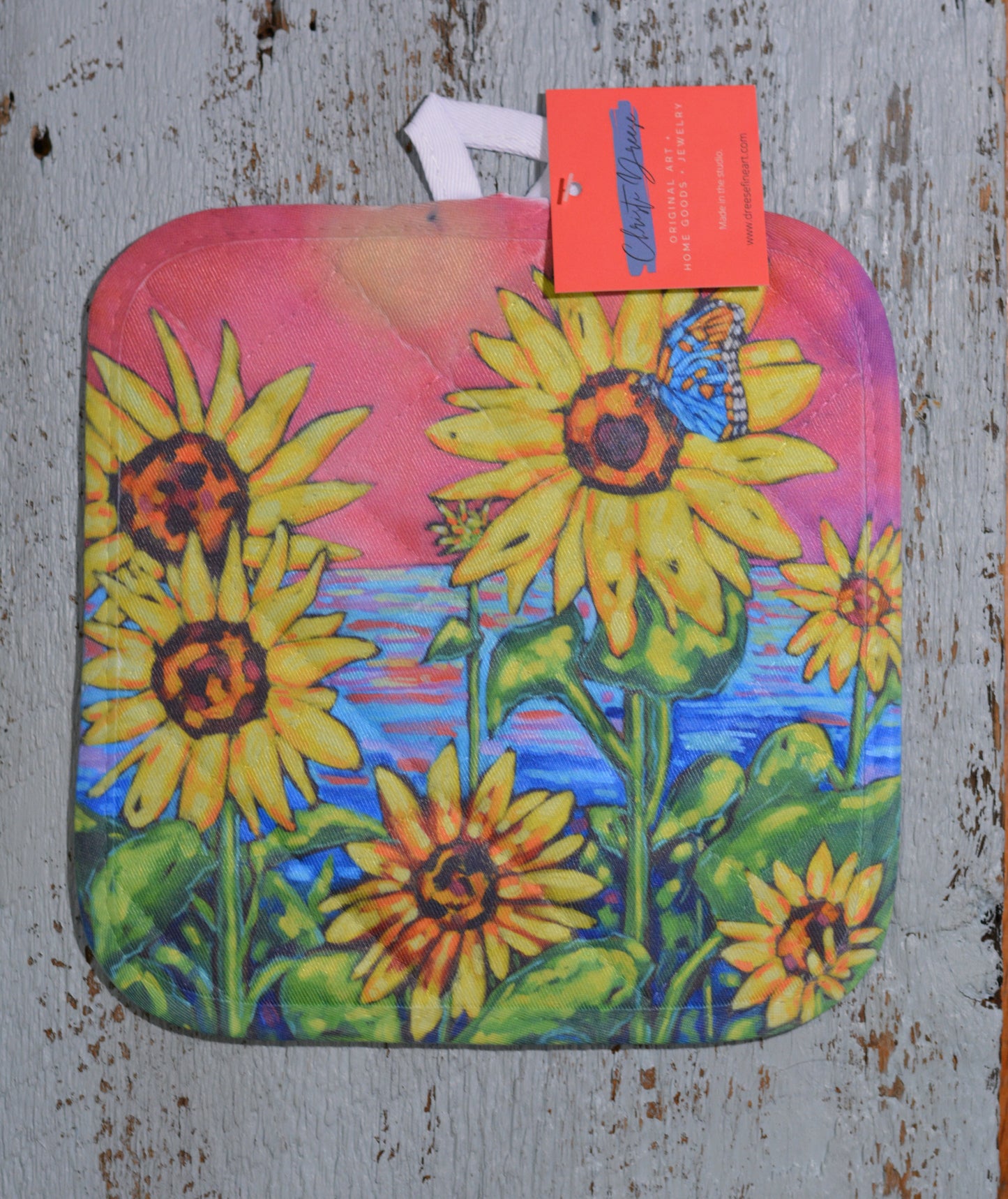 Potholder: Love Can Rebuild This World. Artist Christi Dreese