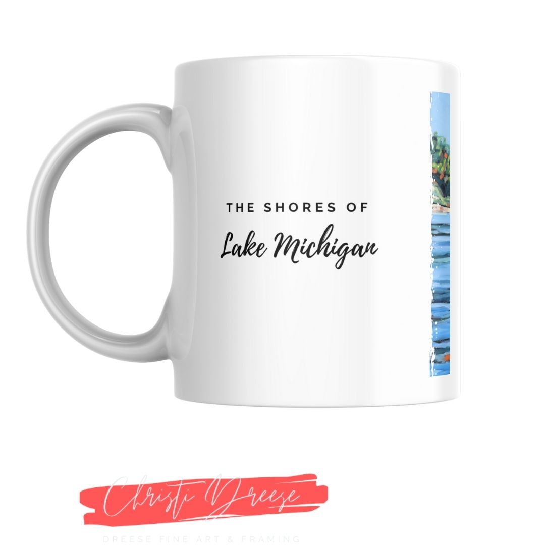 White mug with 'The Shores of Lake Michigan' text and a image of the shoreline on a white background