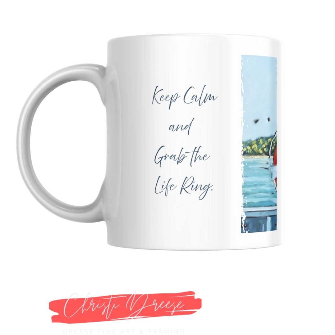 White mug with text 'Keep Calm and Grab the Life Ring' and a beach scene, featuring the name 'Christi Dreese'.
